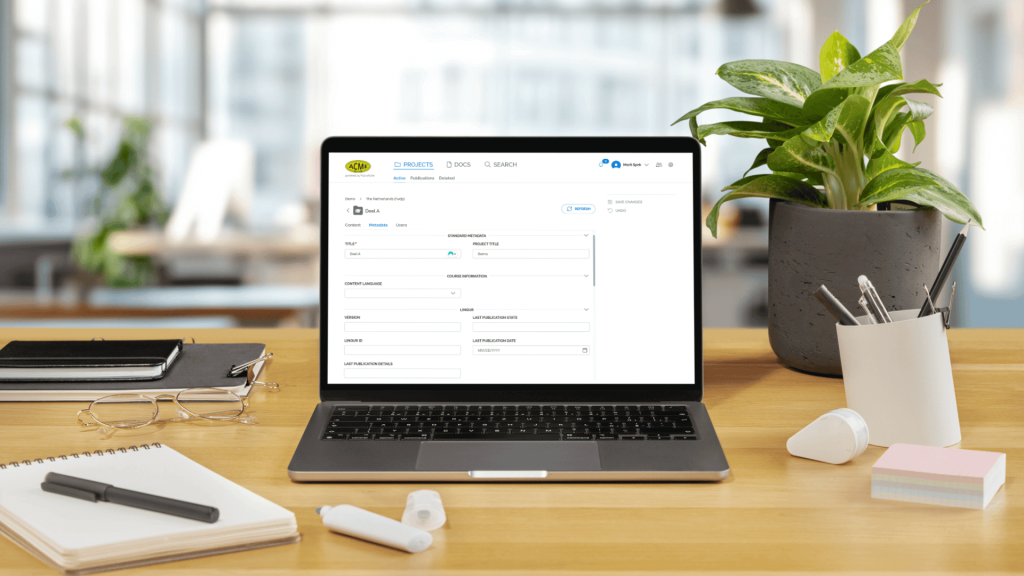 A laptop in an office space, on the screen metadata fields